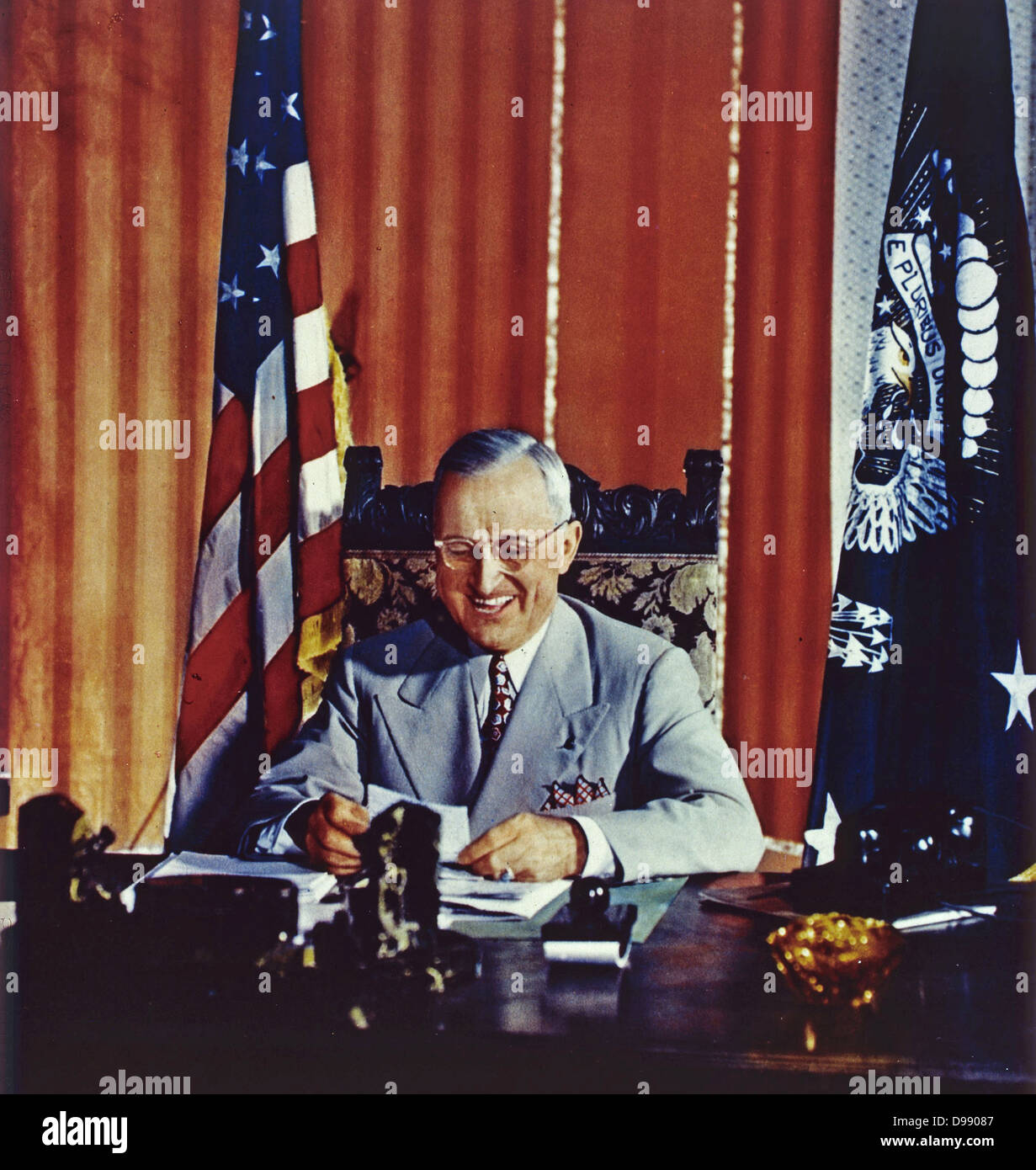 American President Harry S Truman (1884 - 1972) signing the Foreign Aid Assistance Act, which provided a programme of foreign aid to Greece and Turkey. The provision of economic support to any nation resisting communist pressure came to be known as the Truman Doctrine Stock Photo
