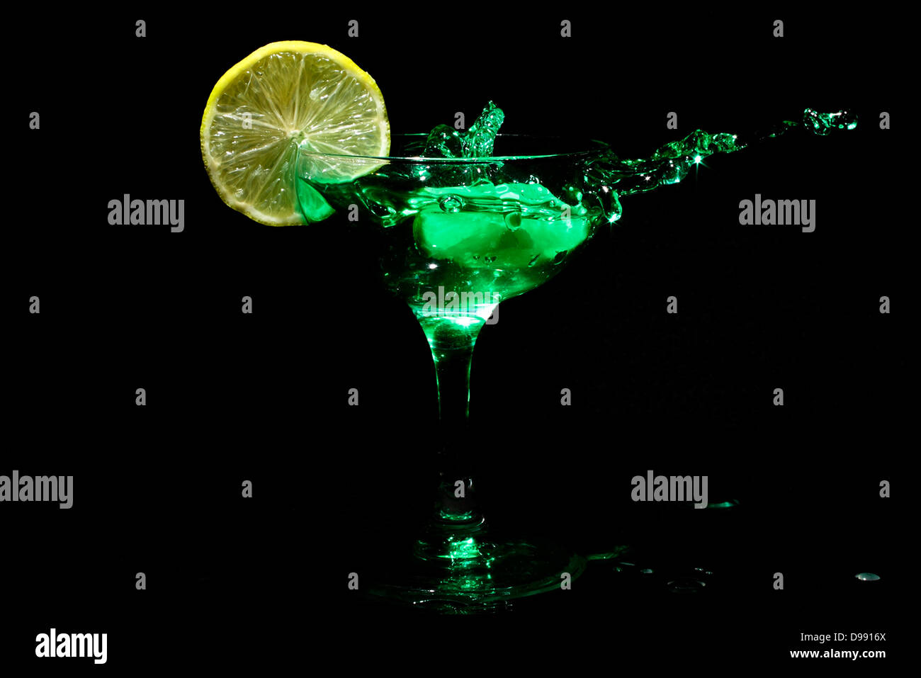 Green cocktail splash with citron Stock Photo