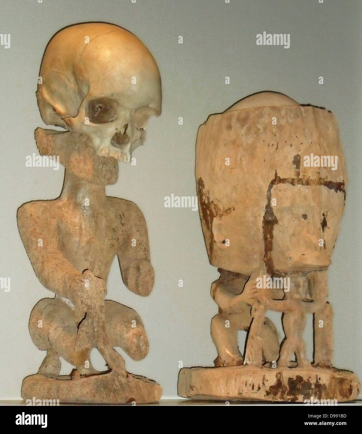 Korwars or ancestral figures. These appear accross Papua New Guinea and are used to recall the memories of the dead. They sometimes include a human skull as a key element.early 20th century Stock Photo