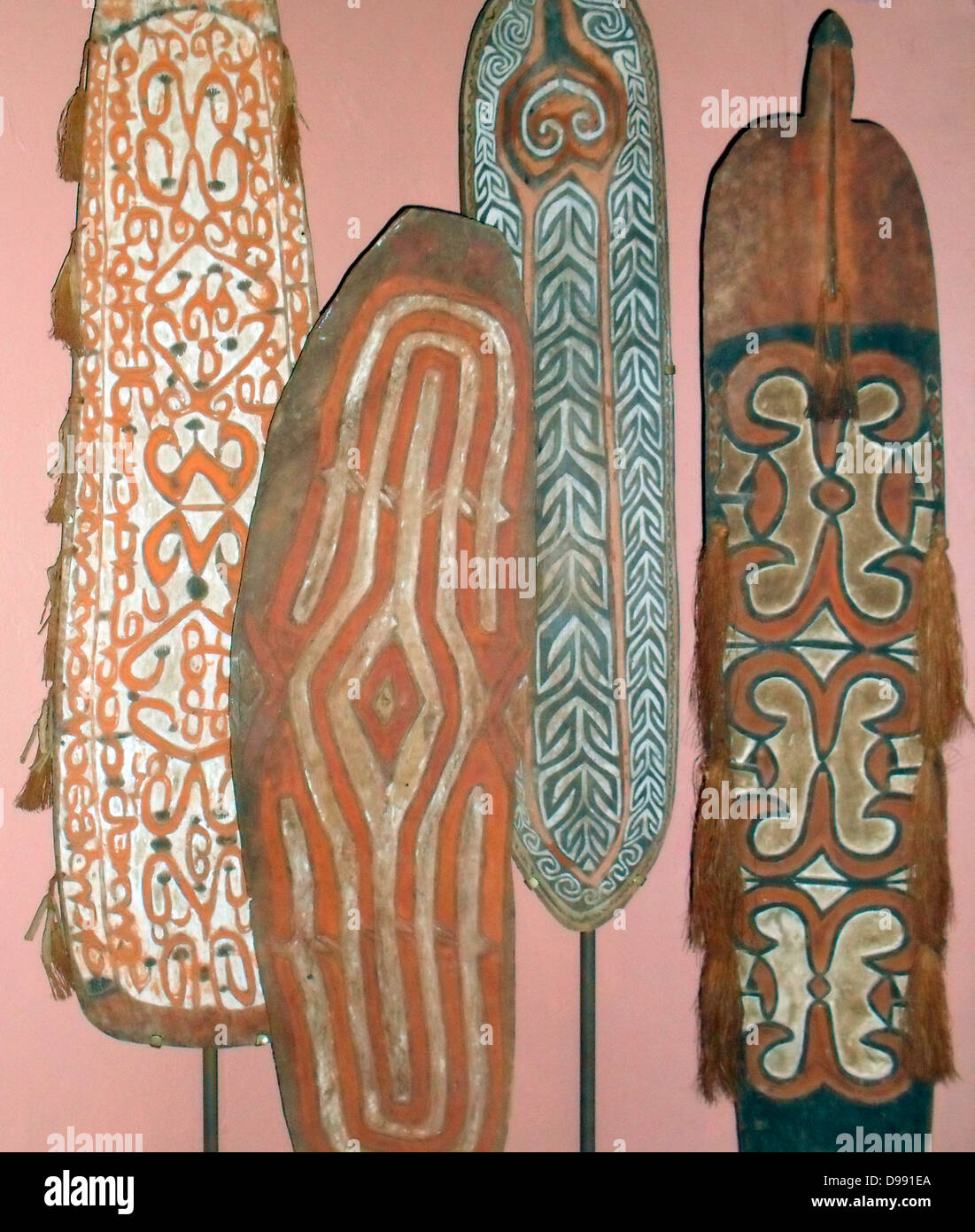 Shields made from wood from various tribal cultures in Merauke, Paua New Guinea. early 20th Century. Stock Photo
