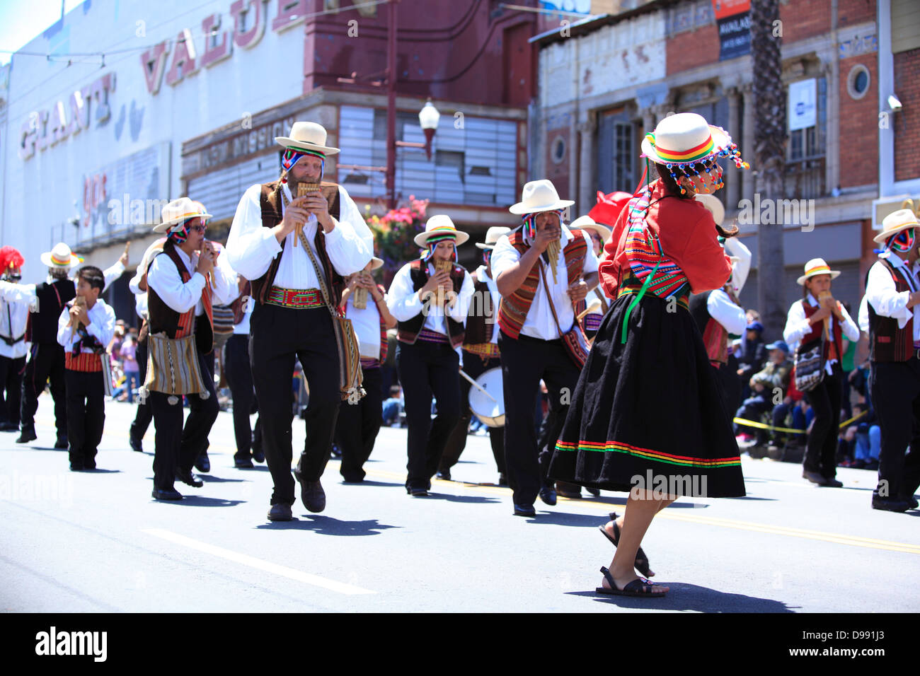 Musicians and dancers in traditional bolivian costume during Carnaval parade in Mission District, San Francisco, California, USA Stock Photo