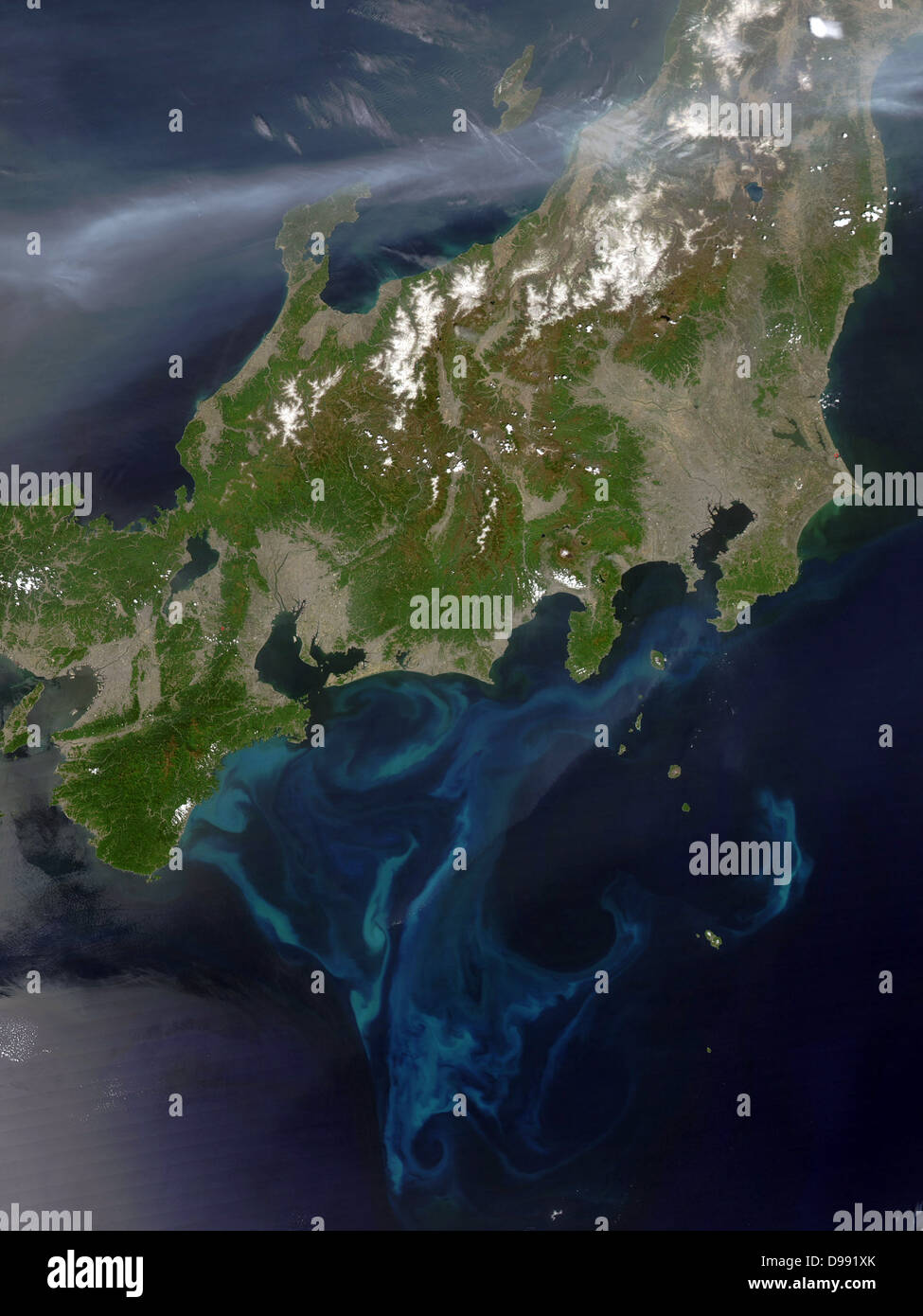 Satellite view of Honshu, Japan, 4 May 2005 with thick plume of smoke crossing the island from the west where intense fires had been burning in North Korea. Credit NASA. Science Earth Geology Pollution Stock Photo