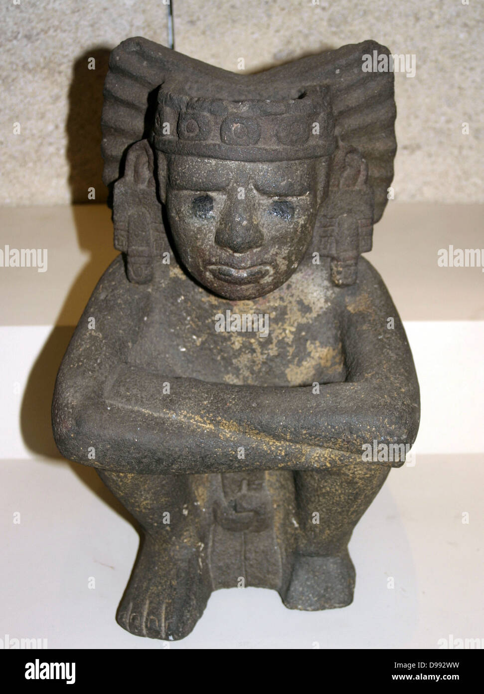 Seated stone figure of Xiuhtecuhtli: Aztec, AD 1325-1521, from Mexico. Xiuhtecuhtli, was the Aztec god of fire. Pre-Columbian Mesoamerican Mythology Sculpture Stock Photo