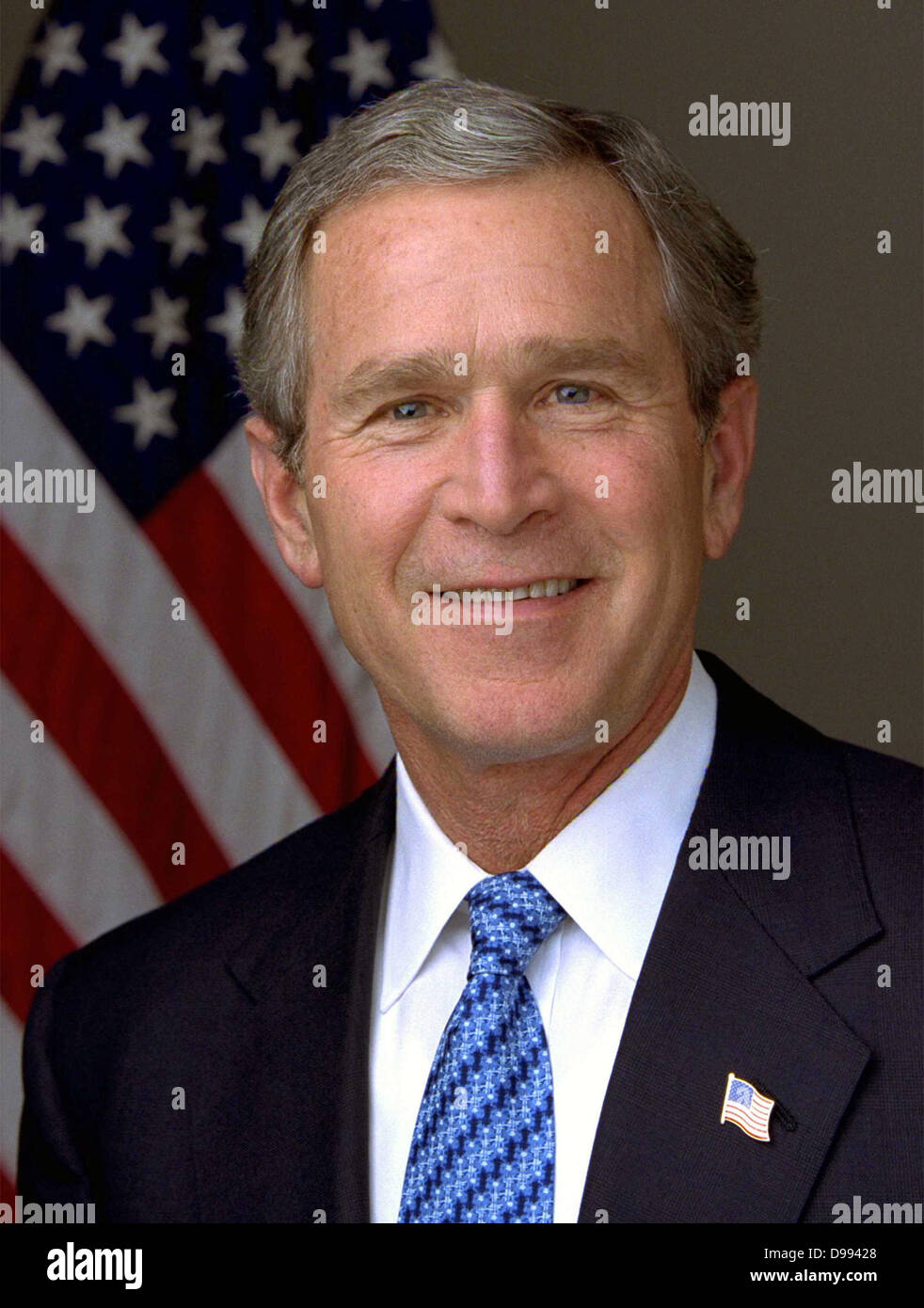 George Walker Bush (born 1946) 43rd President of the United States 2001-2009. 46th Governor of Texas 1995-2000. Head-and-shoulders portrait with stars-and-stripes in background. American Politician Republican Stock Photo