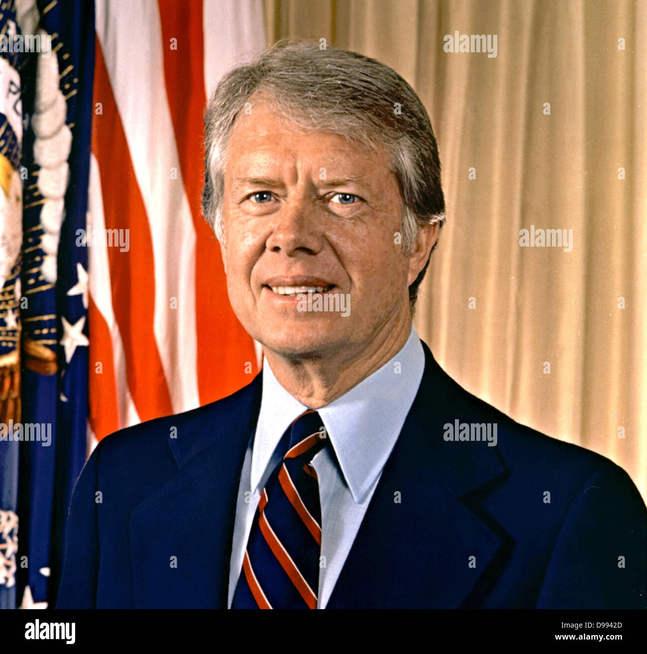 James Earl 'Jimmy' Carter, Jr. (born 1924) 39th President of the United States from 1977 to 1981. Governor of Georgia 1971-1975. Head-and-shoulders portrait with stars-and-stripes in background. American Politician Democrat Stock Photo