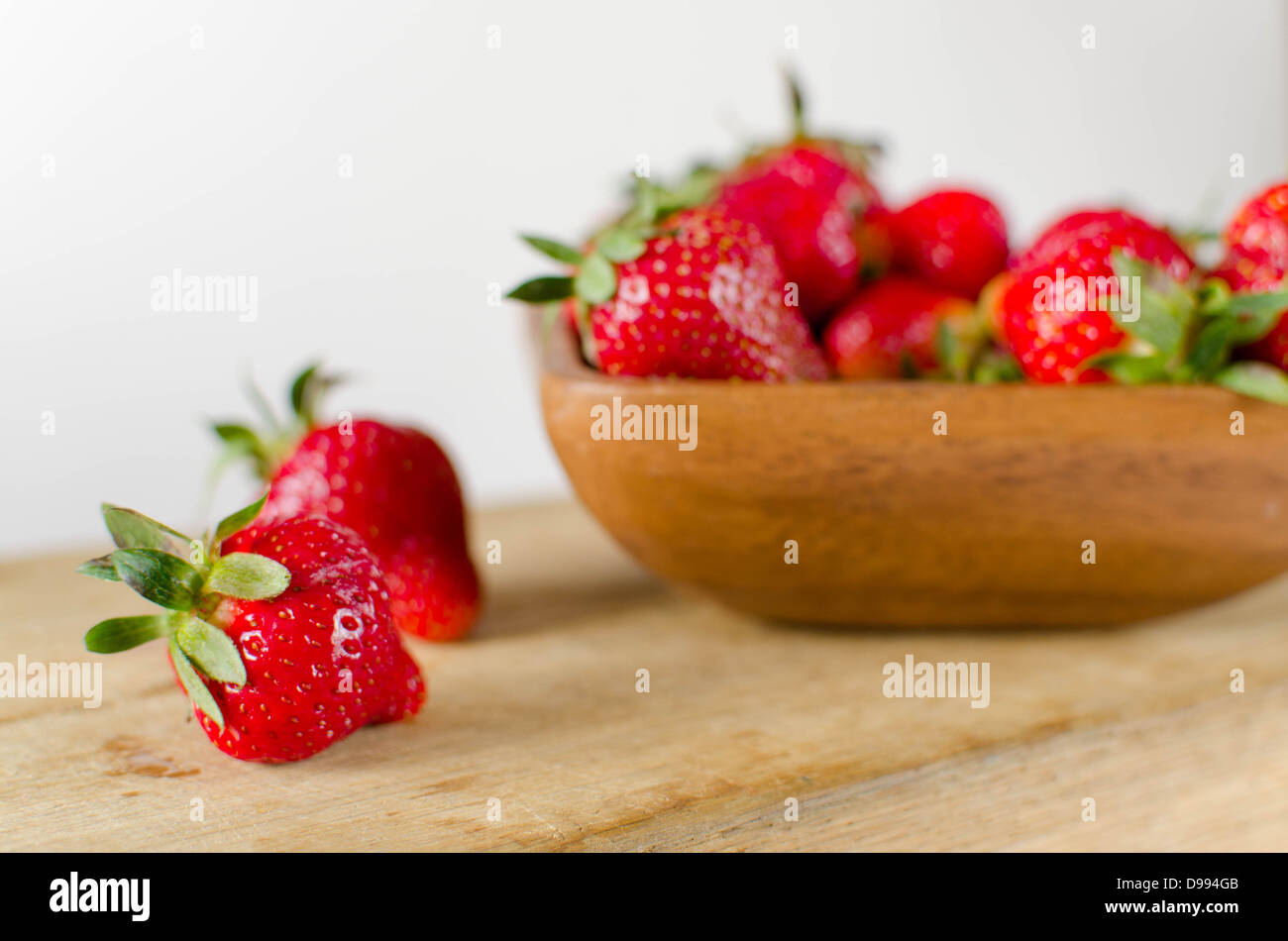 Strawberry in wooden bowl hi-res stock photography and images - Alamy
