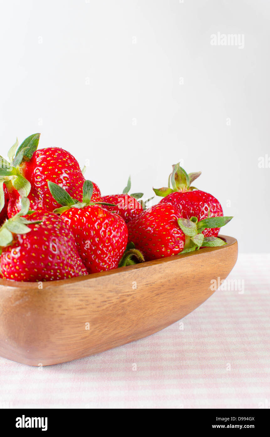 Strawberry in wooden bowl hi-res stock photography and images - Alamy