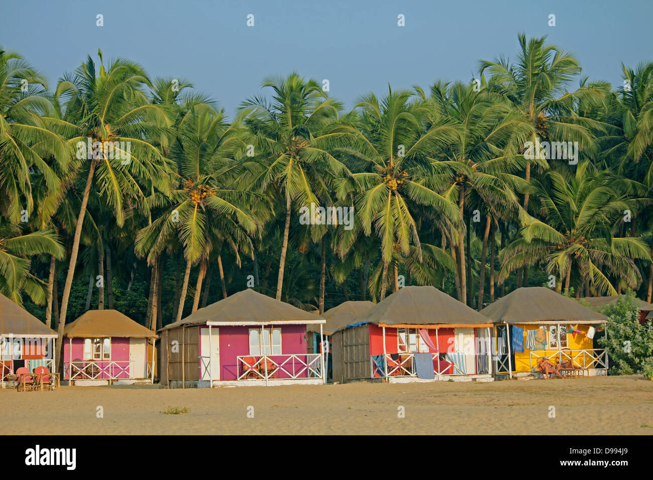 Cocohut beach holiday bungalows on stilts Agonda beach, Goa India Stock Photo