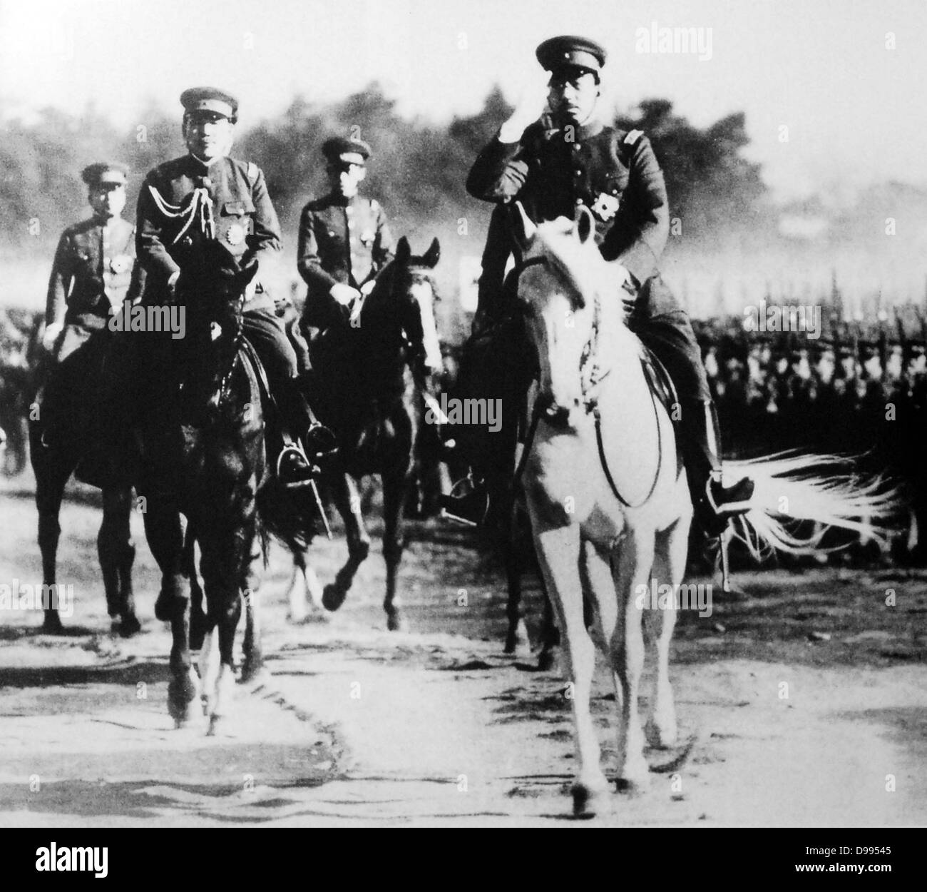 Hirohito (1901–1989) 124th Emperor of Japan (1926-1989). Emperor mounted on white horse at a review of troops, c1937. Stock Photo