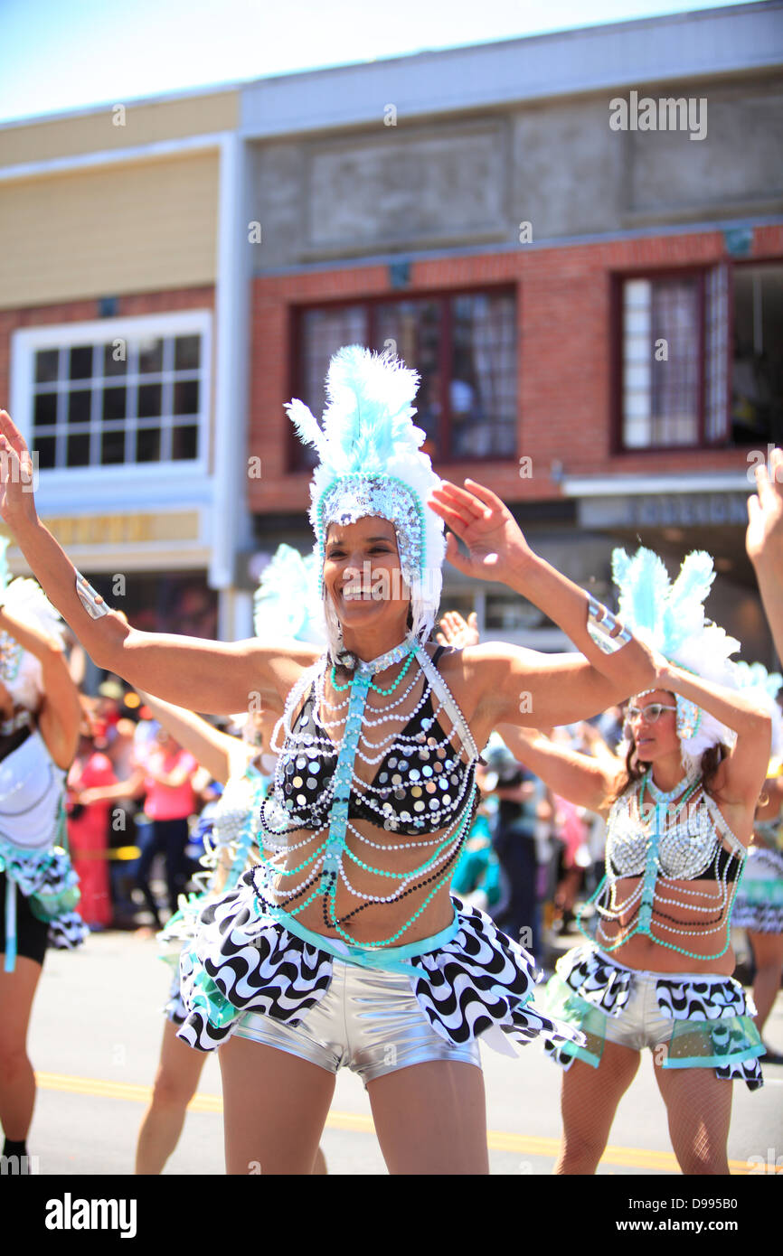Colorful and spirited dancers during carnaval parade in Mission District, San Francisco, California, USA Stock Photo