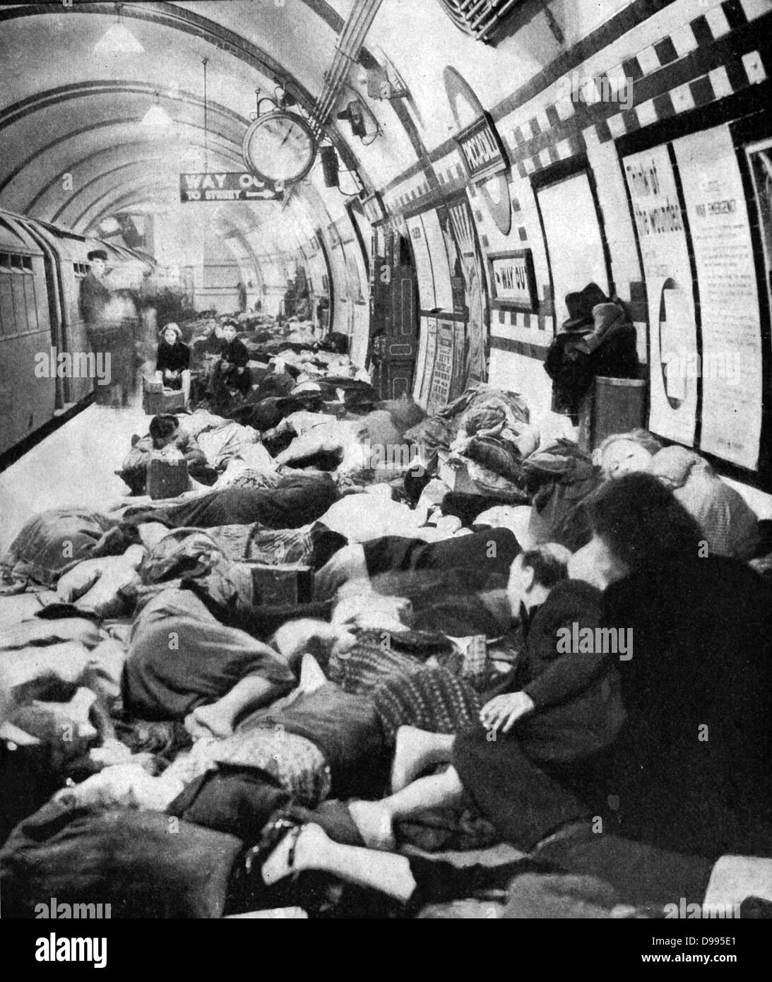 Londoners sheltering on the platform of a station on the Tube (underground railway) during the Blitz. London was bombed on 76 consecutive nights by the Luftwaffe (German Air Force) between July 1940 and May 1941. Stock Photo