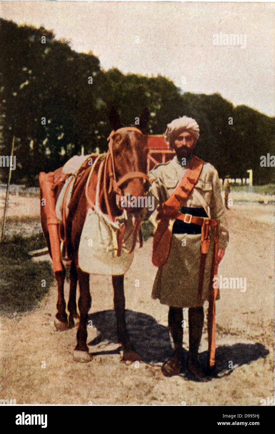 Indian cavalryman in campaign kit, standing beside his mount, c1914. Stock Photo