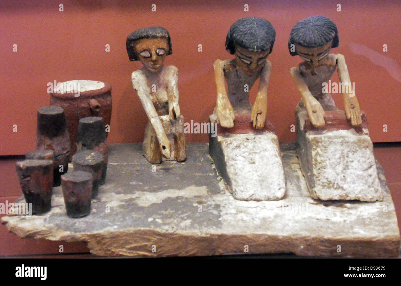 Bakers making bread. Egyptian tombs contained models of aspects of daily life to be taken into the afterlife. Here a model of a bakery. Stock Photo