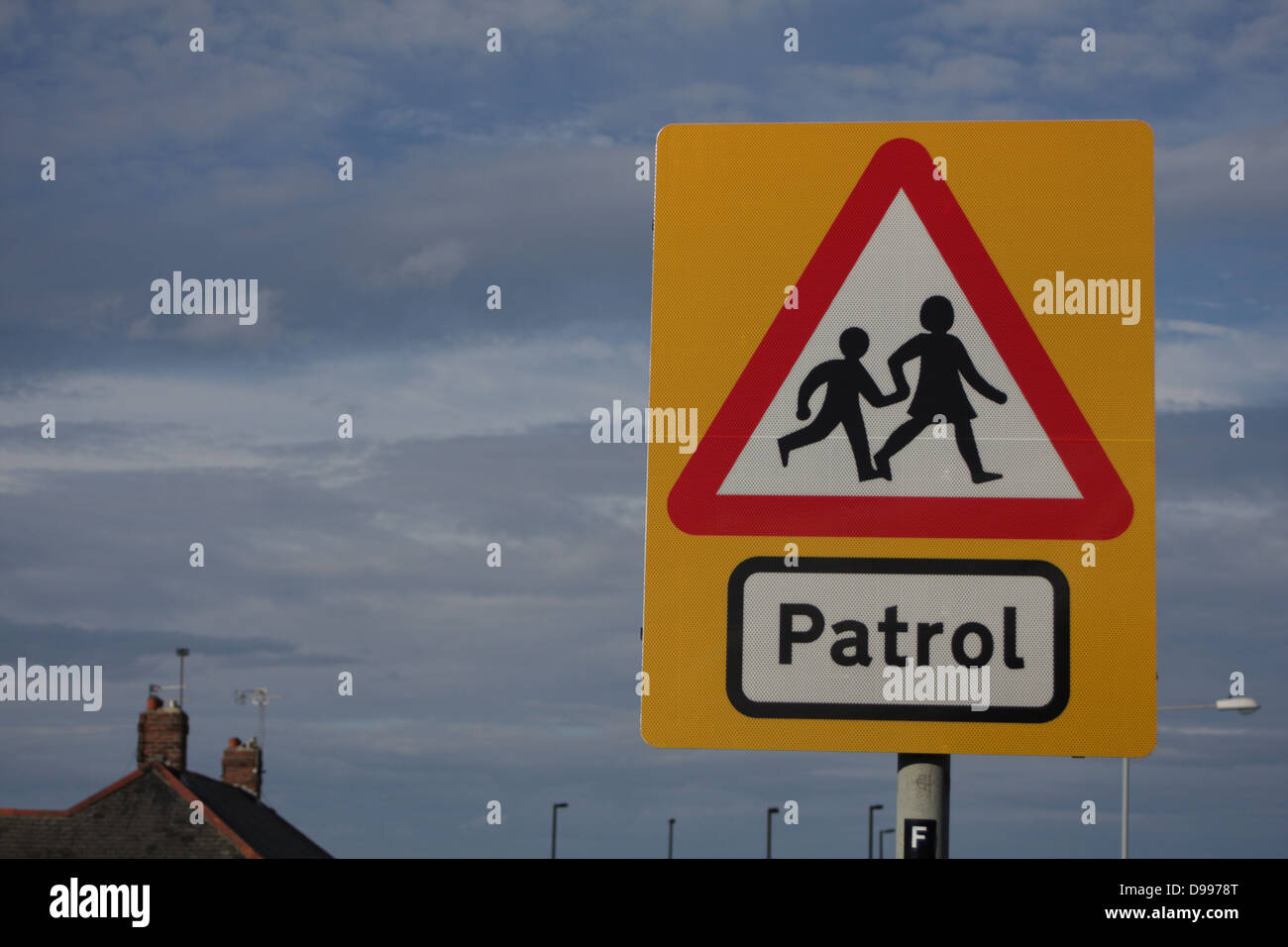 School Patrol - Road traffic sign, warns motorists about children coming and going to and from school. Landscape, to right. Stock Photo
