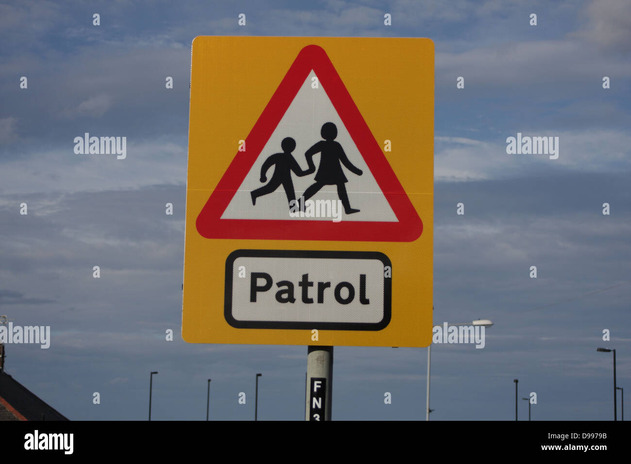 School Patrol - Road traffic sign, warns motorists about children coming and going to and from school. Sign central, landscape Stock Photo