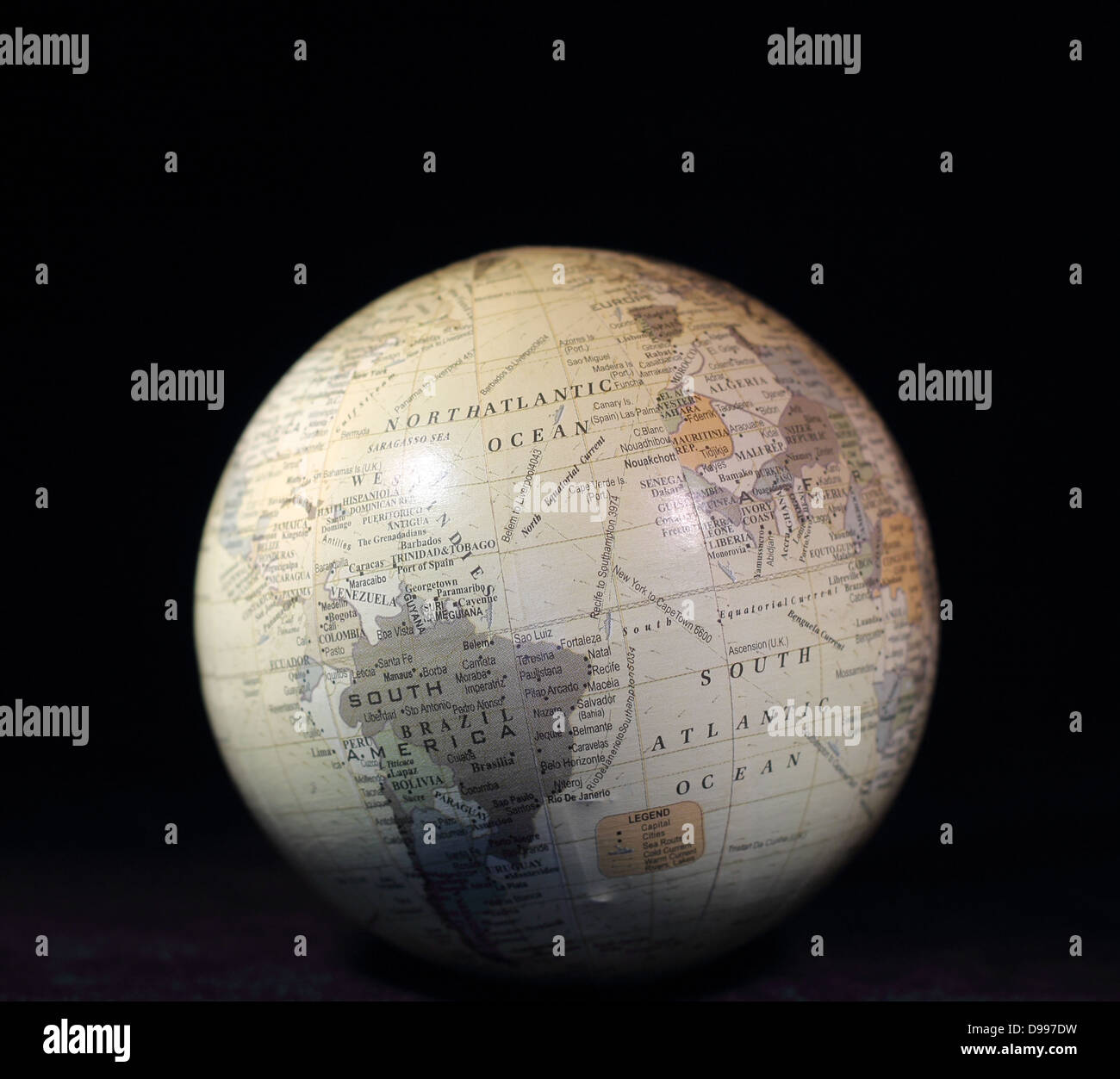 White globe with text on a black background Stock Photo