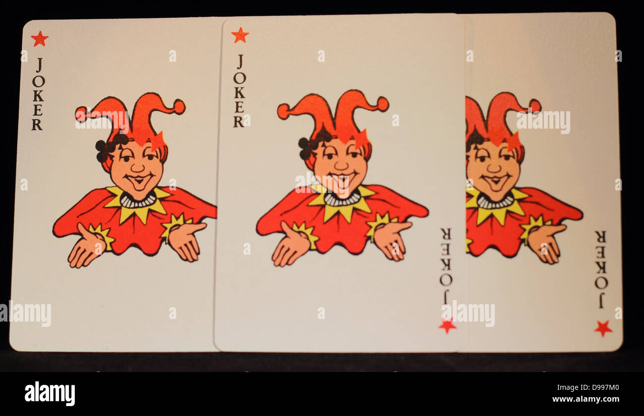 Three jokers, playing cards. Jokers in red focus on joker in the middle. Stock Photo