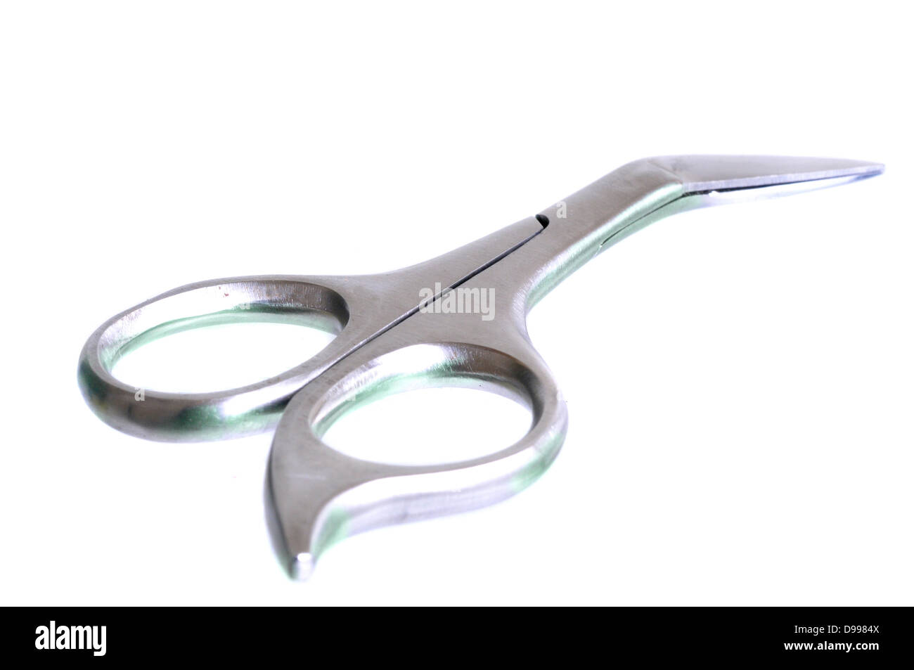 Small scissors isolated on white Stock Photo