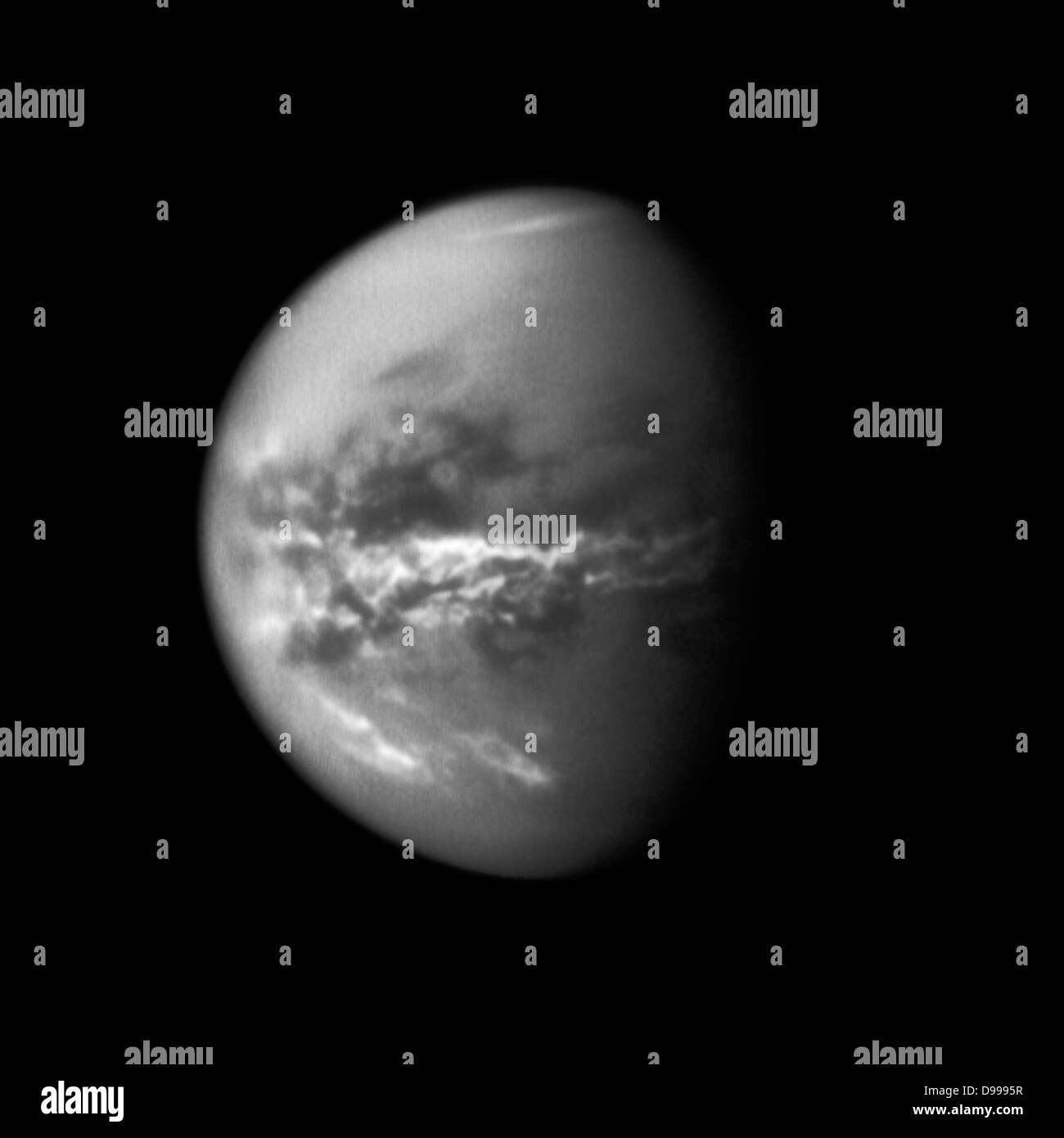 NASA's Cassini spacecraft chronicles the change of seasons as it captures clouds concentrated near the equator of Saturn's largest moon, Titan. Stock Photo