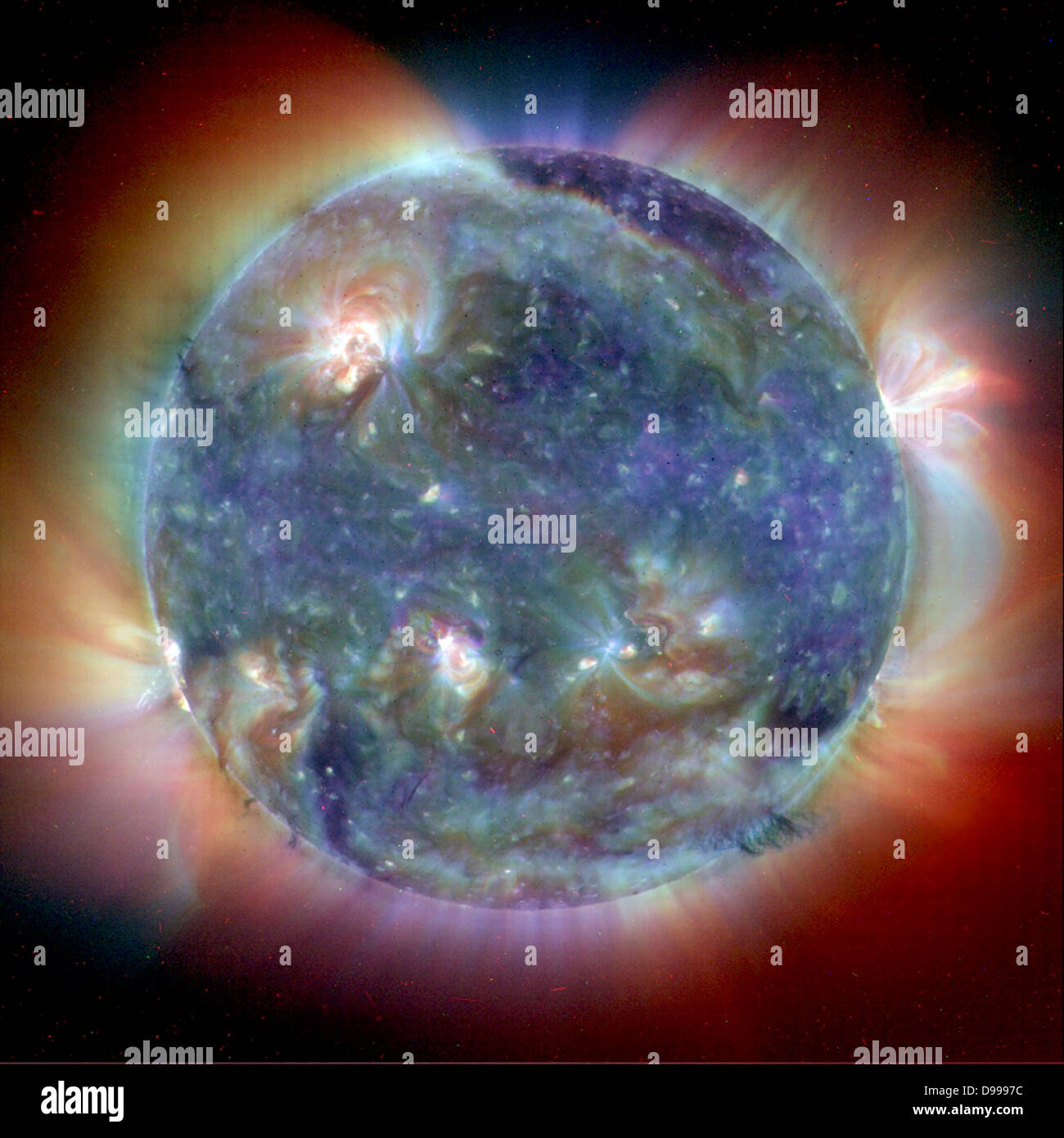 This composite image combines Extreme Ultravoilet Imaging Telescope (EIT) images from three wavelengths into one that reveals solar features of the Sun unique to each wavelength. Stock Photo