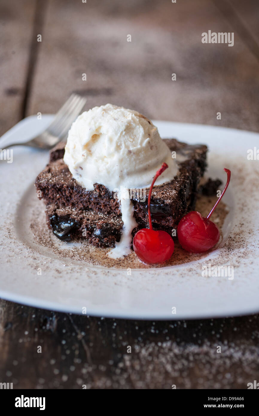 fudge brownie ala mode' with cherries Stock Photo Alamy