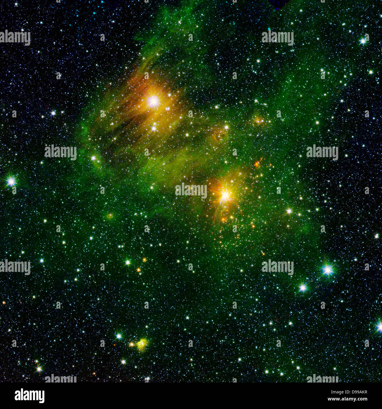 Two extremely bright stars illuminate a greenish mist in this and image from the new 'GLIMPSE360' survey from NASA's Spitzer Space Telescope. Stock Photo