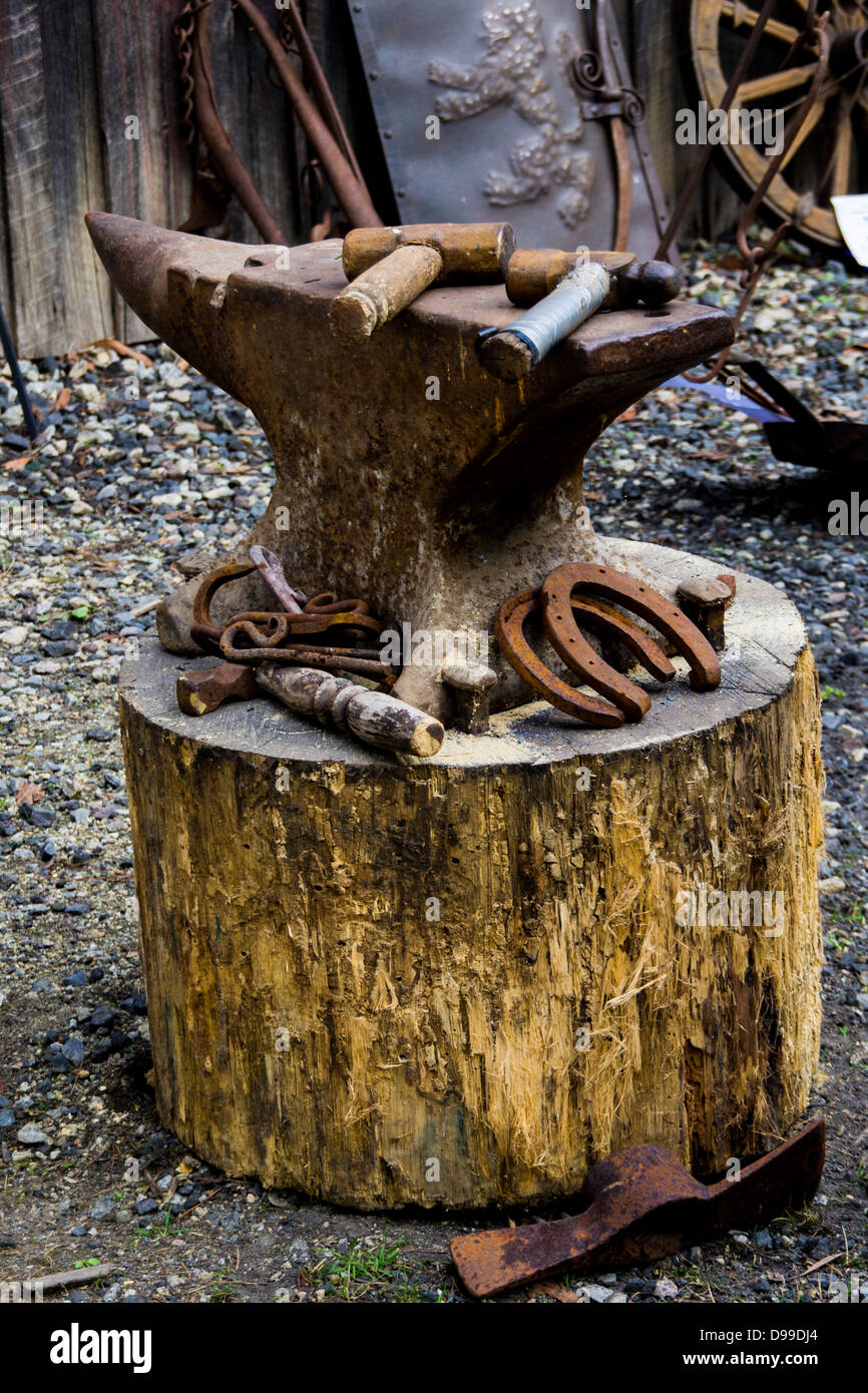 Blacksmith Anvil on wood block Stock Photo