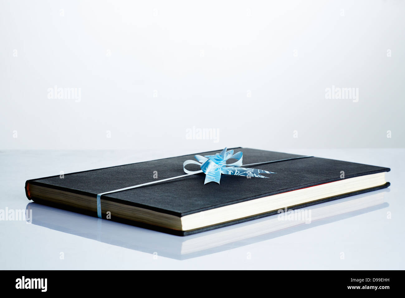 Book with ribbon hi-res stock photography and images - Alamy