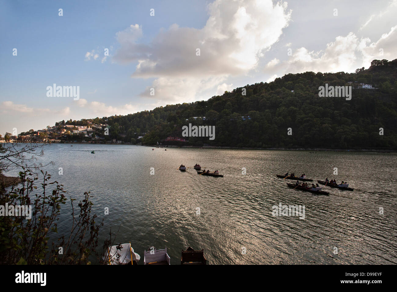 People rowing boats in a lake, Nainital, Uttarakhand, India, Asia Stock Photo