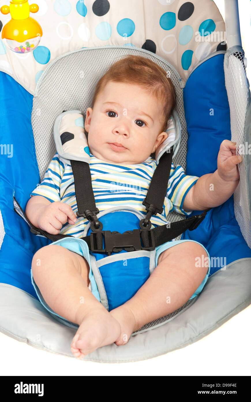 Close up of little baby boy in blue electric swing Stock Photo Alamy