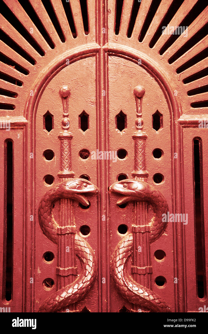 Red Crypt Door with Serpents Stock Photo