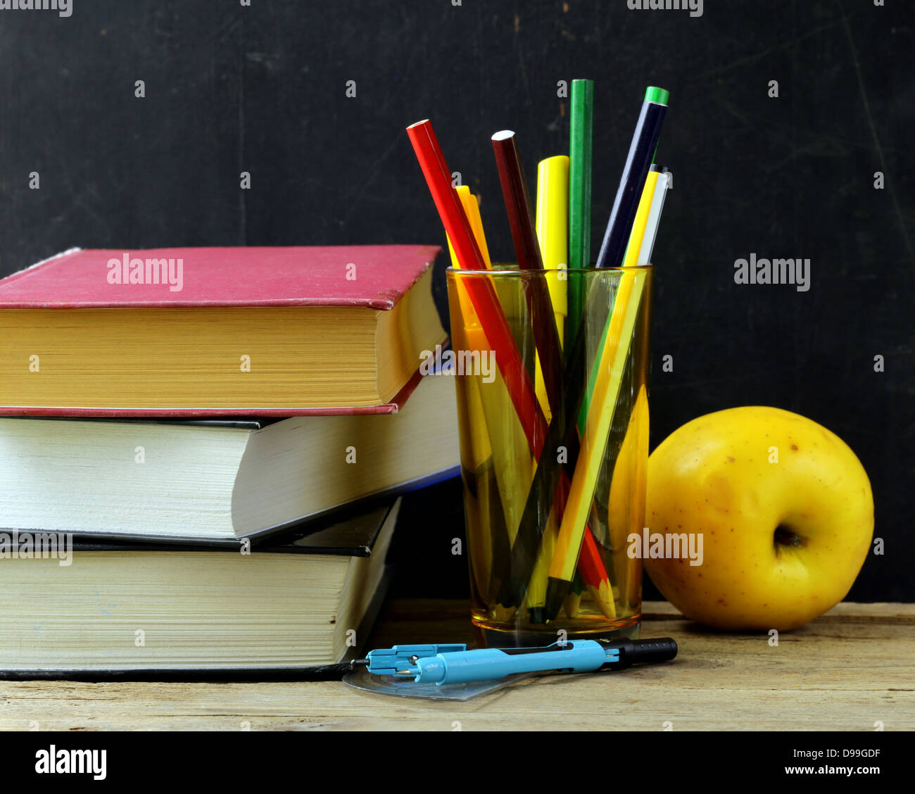 stationery (pen, pencil, ruler, compass) and a book on black school