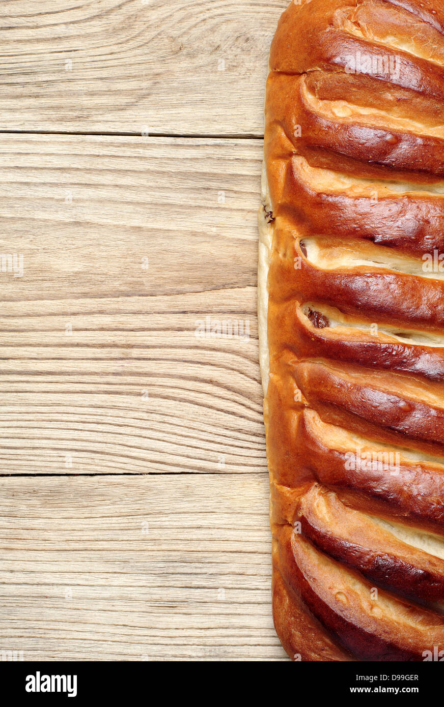 Background with white bread on a wooden table Stock Photo - Alamy