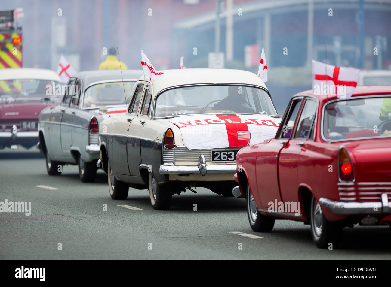 The 10th St Georges day parade on Oldham Street Manchester classic cars make their way through Manchester Stock Photo