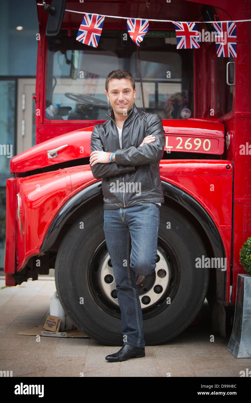 Casual portrait celebrity chef Gennaro 'Gino' D'Acampo and a London Route master red bus Stock Photo