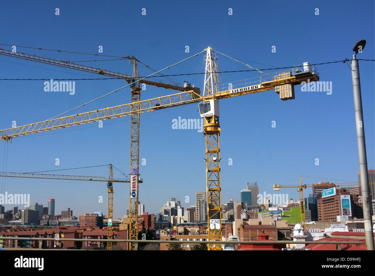 Large tower cranes in central Johannesburg. Stock Photo