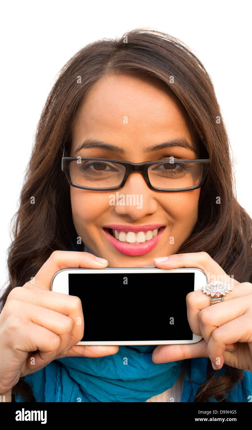 Portrait of a woman showing a mobile phone and smiling Stock Photo