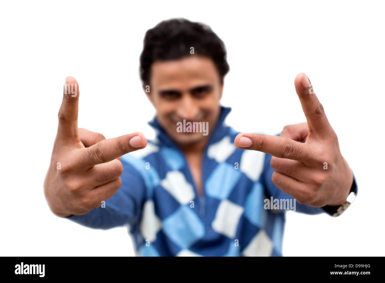 Portrait of a man showing victory sign Stock Photo