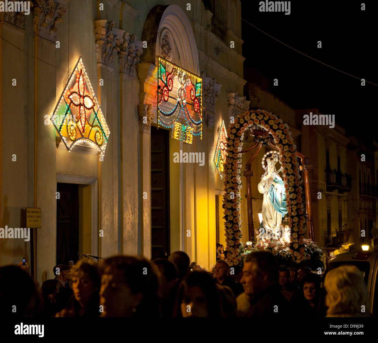 A Christmas church parade through the streets of Castellammare Del Golfo in Sicily. Stock Photo