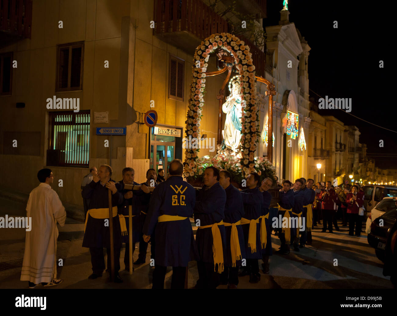 A Christmas church parade through the streets of Castellammare Del Golfo in Sicily. Stock Photo