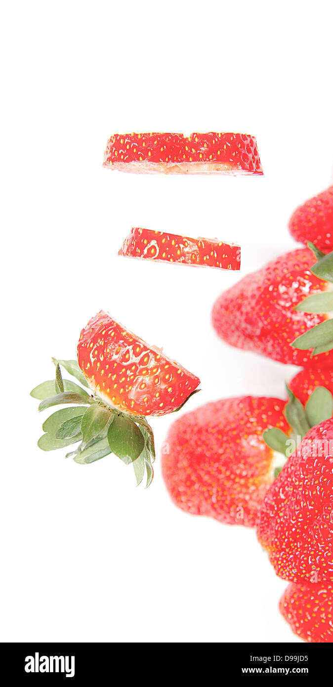 Cut strawberries isolated on white background Stock Photo