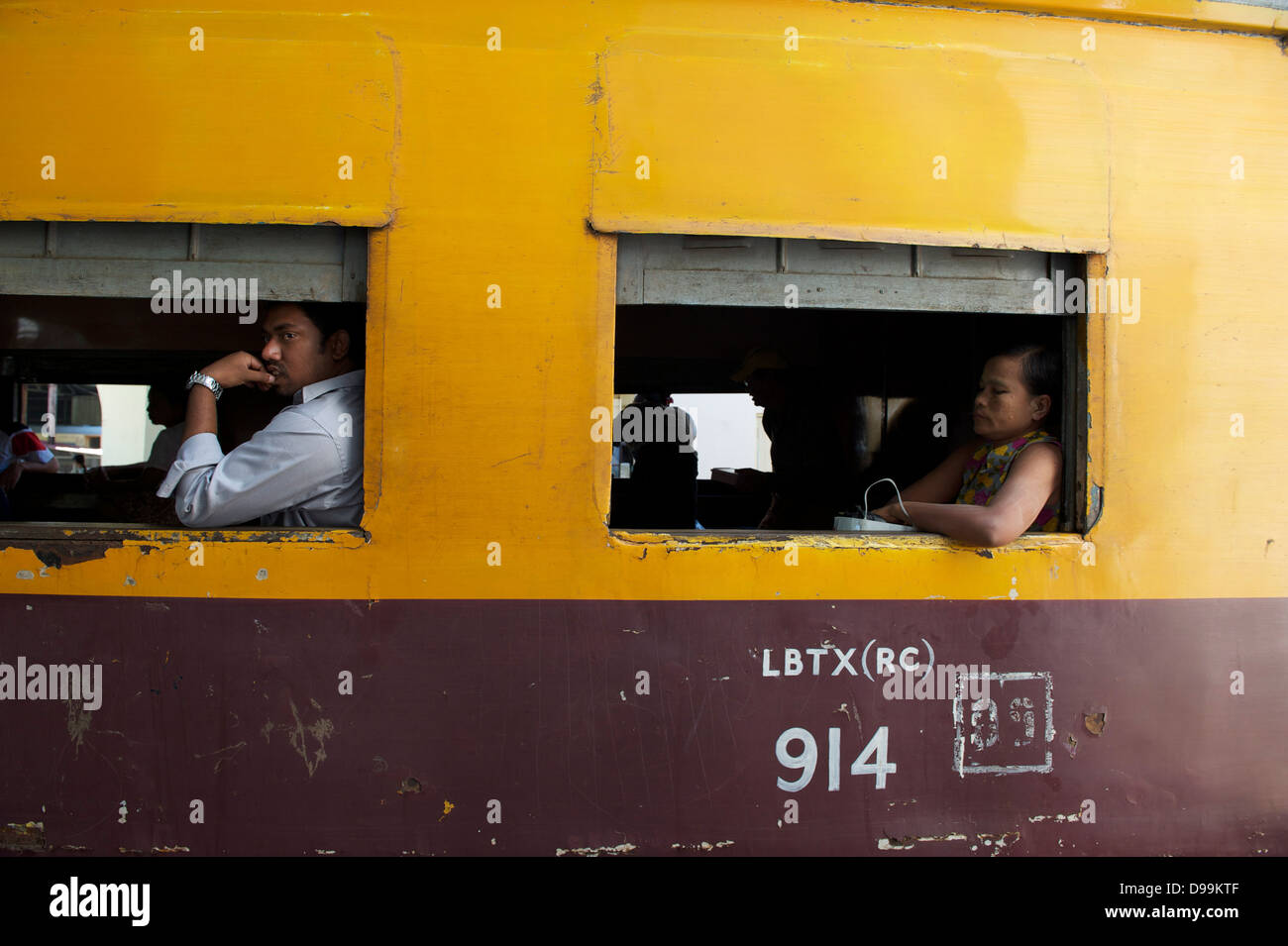 passengers riding train in Yangon Stock Photo