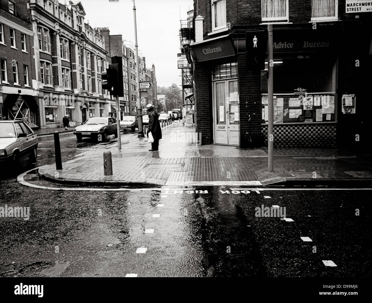 Wet street scene in Marchmont Street, near the Brunswick Centre, Russell Square Bloomsbury, London Stock Photo