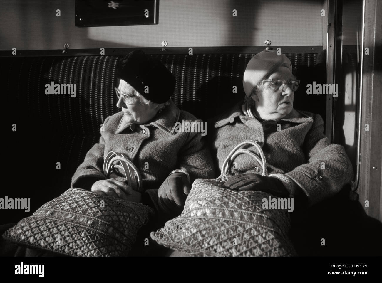 Elderly twins traveling in railway compartment, 1981. Stock Photo