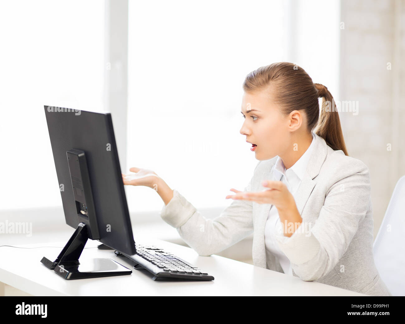 stressed student with computer in office Stock Photo - Alamy