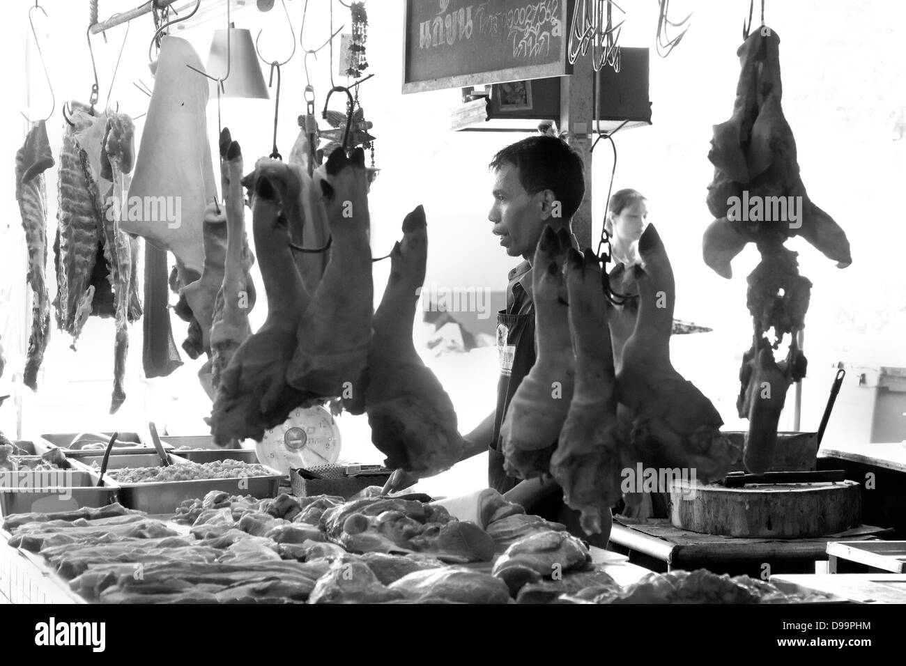 BANZAAN MARKET, PATONG, PHUKET, THAILAND MAY 18 2013: Butcher at the Banzaan Fresh Market, Phuket Stock Photo