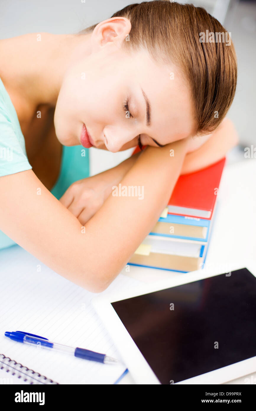 tired student sleeping on stock of books Stock Photo - Alamy