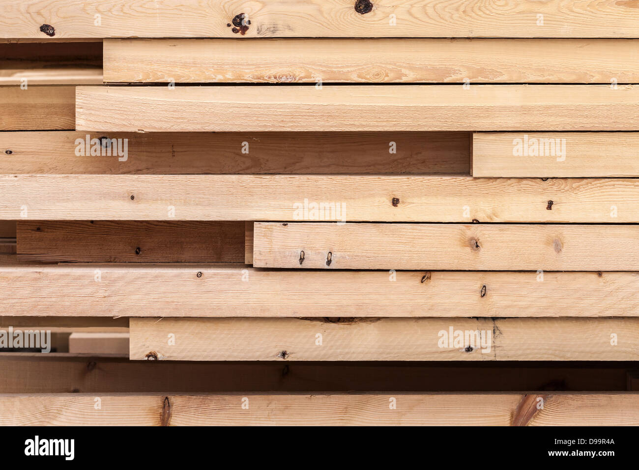 Pile of new wooden boards on a storage. Side background texture Stock Photo