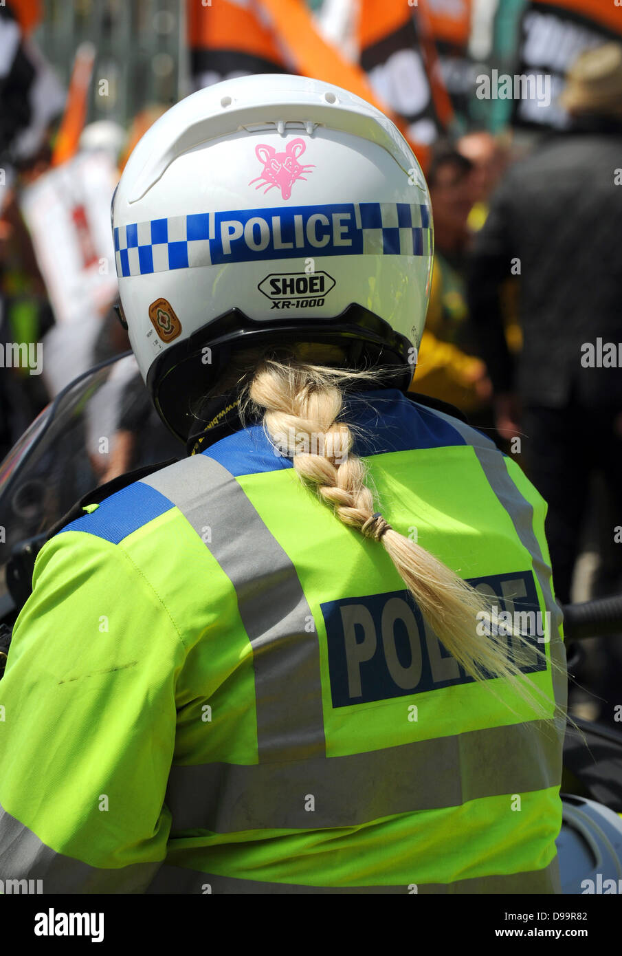 Female motorcycle police officer with her hair tied into a 