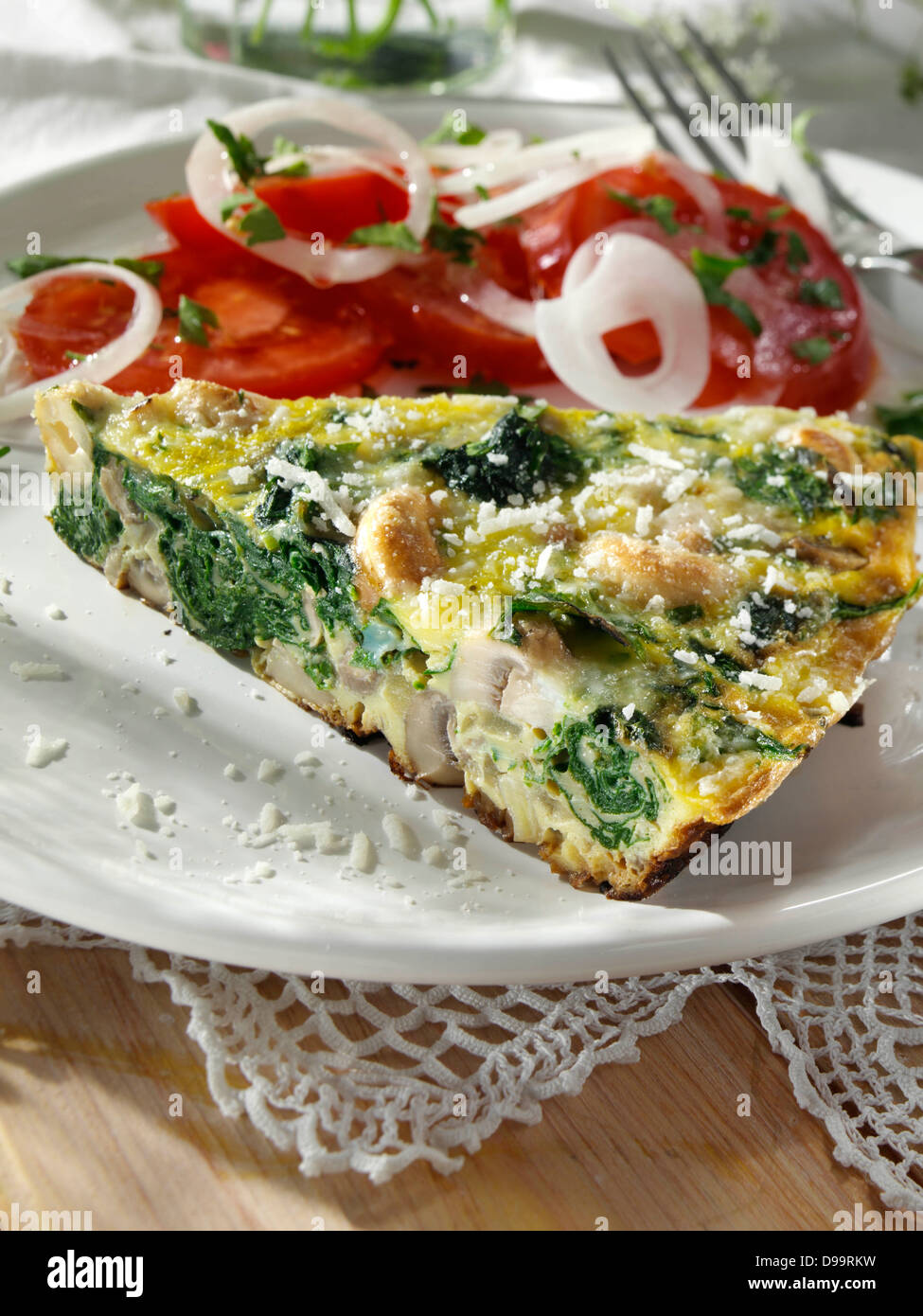 Frittata with mushrooms spinach onions and cashews Stock Photo Alamy